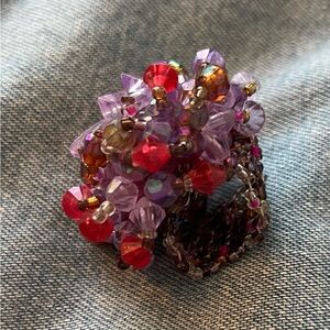 Artist made beaded ring, pinks and purples.